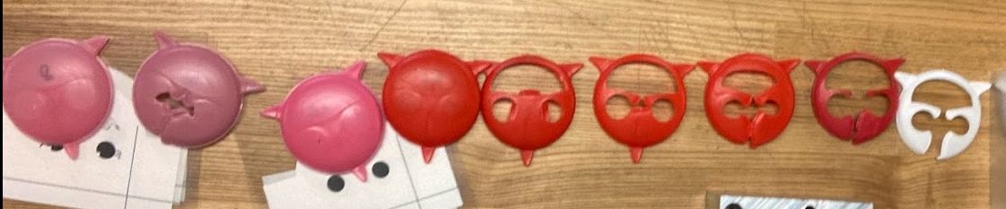 Row of thermoformed plastic pucks