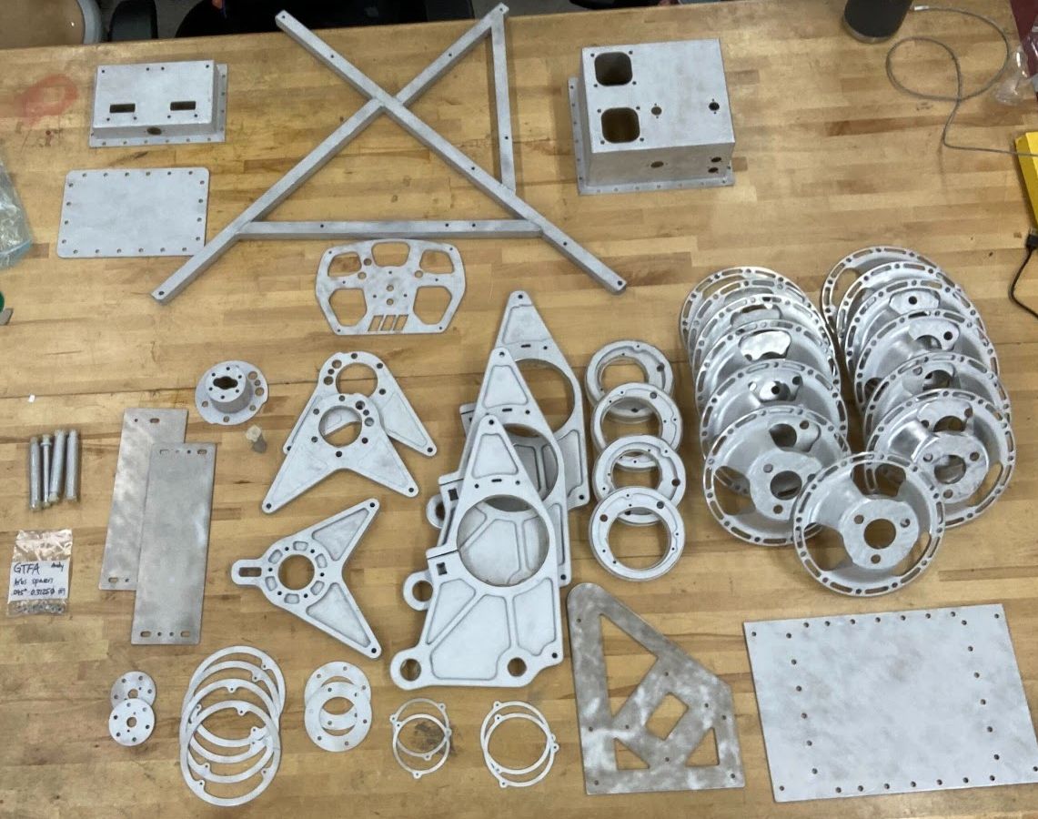 Raw machined aluminum parts before anodizing